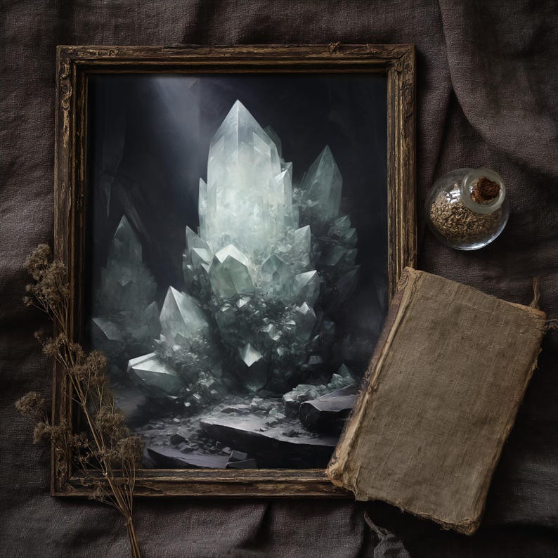 Witchy crystal cave print in rustic frame, styled with vintage book and dried flowers, moody cottagecore wall art.
