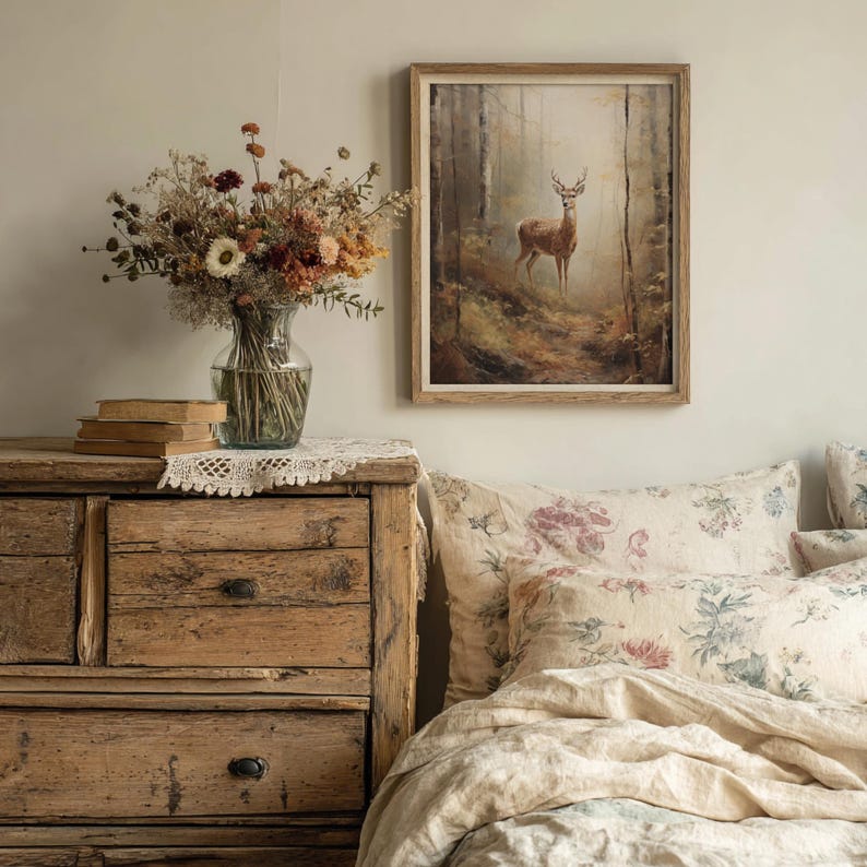 Forest-themed printable wall art in oil painting style showing a deer on a wooded path, designed for lovers of rustic charm and cozy cottagecore or dark academia spaces.