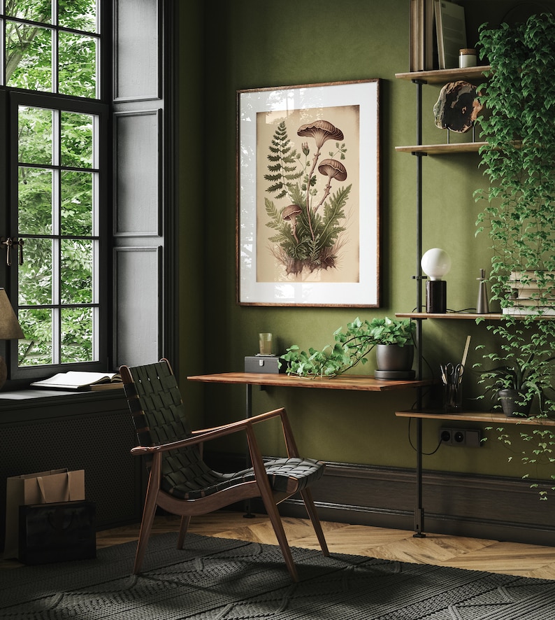 May include: A green wall with a framed botanical print of mushrooms and ferns. A wooden desk with a chair sits in the corner of the room. A shelf with plants and books is on the right side of the wall.
