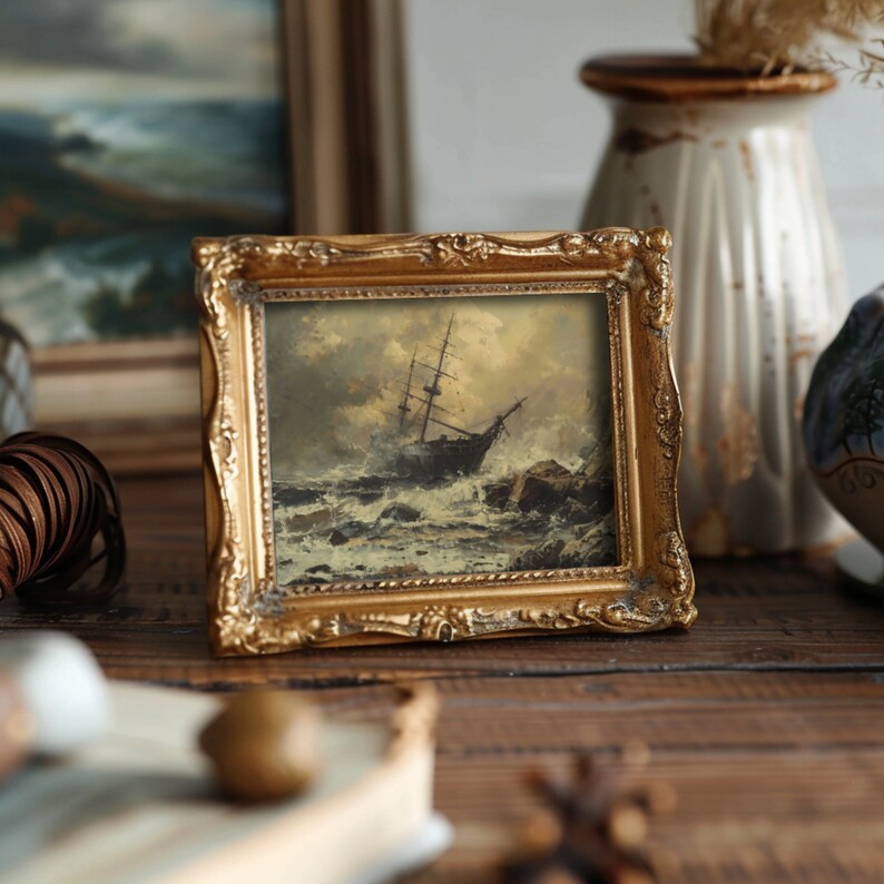 Antique bathroom art featuring a dark nautical art print of a ship struggling in a storm, enhancing coastal gallery wall themes.