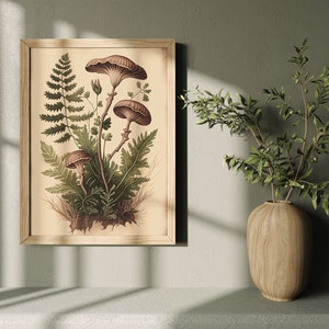 May include: A framed vintage botanical illustration of mushrooms and ferns. The illustration is in shades of brown, green, and cream. The frame is a light wood color.