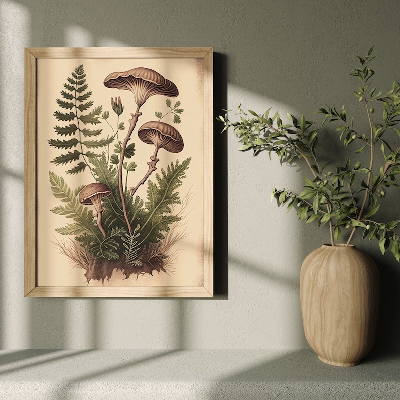May include: A framed vintage botanical illustration of mushrooms and ferns. The illustration is in shades of brown, green, and cream. The frame is a light wood color.