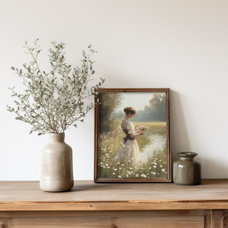 Rustic wall art print featuring a countryside meadow scene, blending vintage aesthetics with cottagecore and floral nursery decor themes.
