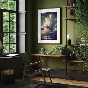 May include: A home office with a wooden desk, a black leather chair, and a framed print of a cloudy sky. The room has dark green walls and a wooden shelf with plants and books.