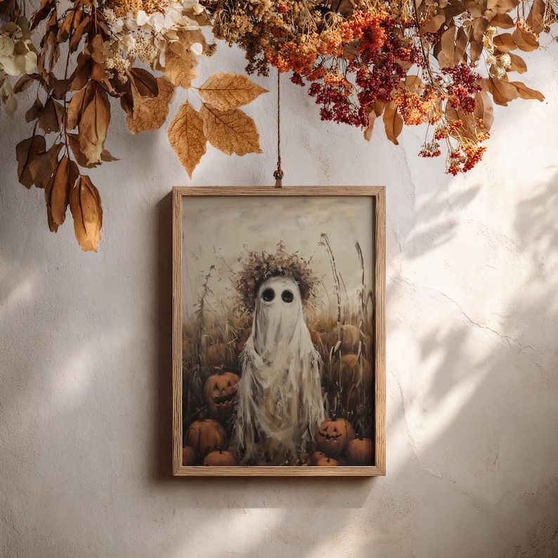 Fall-themed art print of a field ghost and pumpkins, perfect for enhancing your rustic autumn decor.