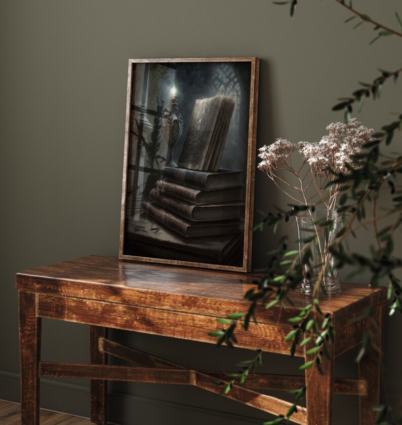 May include: A framed painting of a stack of old books with a lit candle in a candlestick on a dark background.