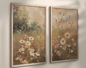 May include: Two framed floral paintings with a light brown background. The paintings feature a field of wildflowers in shades of pink, white, and yellow. The paintings are framed in a light brown wood frame.
