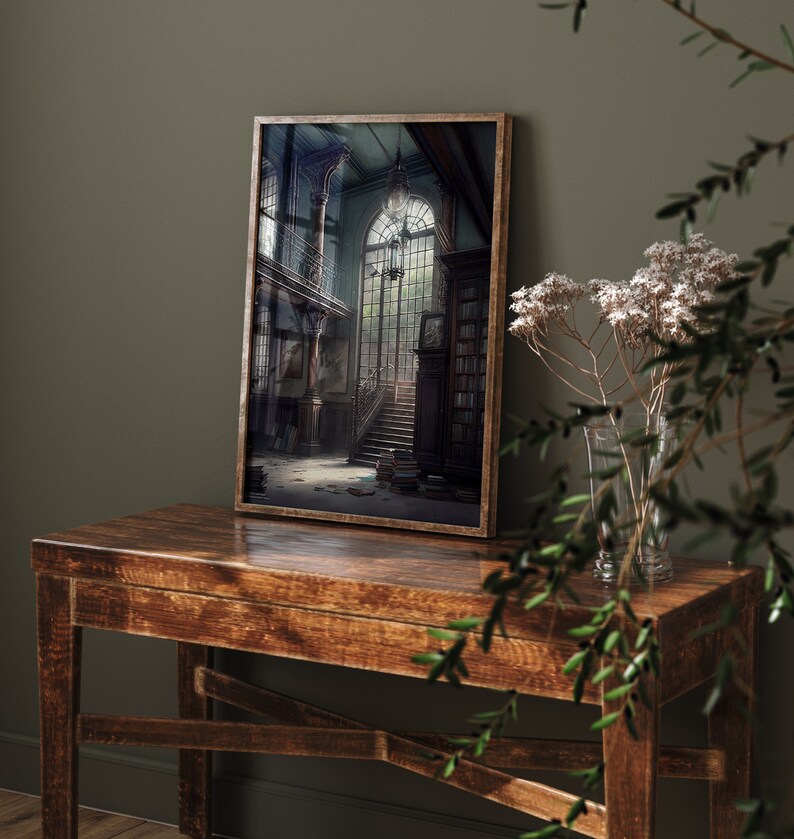 May include: A framed print of a dark, vintage interior with a grand staircase leading up to a large window. The room is filled with bookshelves and other antique furniture.
