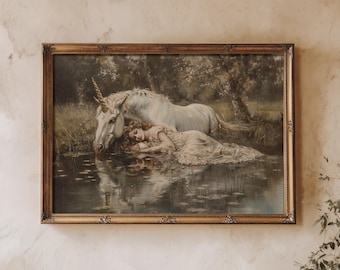 May include: A framed painting of a woman sleeping next to a white unicorn in a forest setting. The unicorn is drinking from a pond and the woman is lying on her side with her head resting on the unicorn's neck. The painting is in a gold frame.