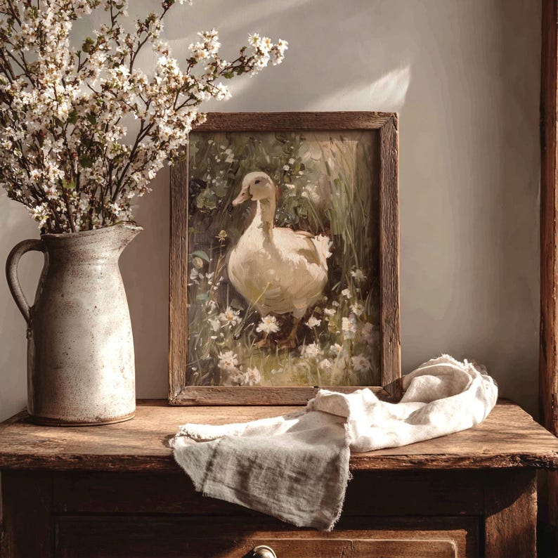 Cottagecore wall art showcasing a goose surrounded by wildflowers, blending rustic farmhouse art with a moody spring aesthetic.