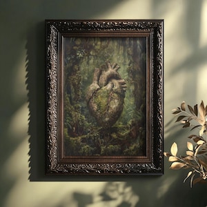 May include: A framed painting of a heart-shaped rock covered in moss and vines, set against a backdrop of lush green foliage. The painting is in a dark brown frame with ornate details.