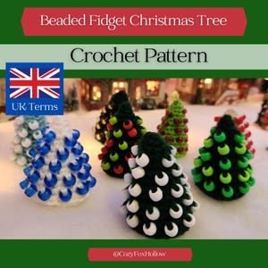 May include: A collection of beaded fidget Christmas trees in various colors, including blue, green, and red. The trees are crocheted and adorned with beads, with the text "Beaded Fidget Christmas Tree Crochet Pattern" at the top.