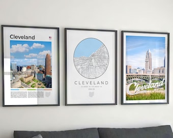May include: Three framed prints of Cleveland, Ohio. The first print features a photo of the city skyline. The second print features a map of Cleveland in a circle. The third print features a photo of the city skyline with the word "Cleveland" in large white letters.