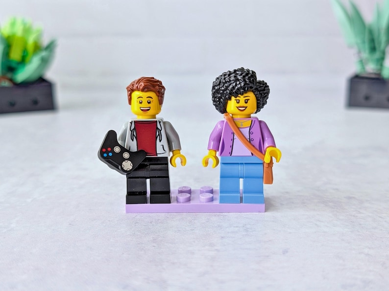 A pair of mini figures with accessories