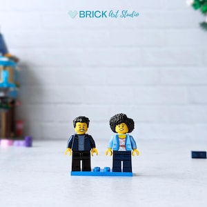 Mini figure couple with building sets blurred in background