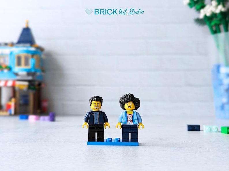Mini figure couple with building sets blurred in background