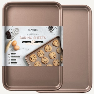 May include: Two 15-inch gold baking sheets with a nonstick coating. The baking sheets are made of heavy gauge carbon steel and are dishwasher safe. The image also shows a package with the text "HAPPIELS PREMIUM BAKING SHEETS 15IN / 39CM 2 PANS".