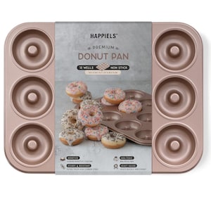 May include: A rose gold, non-stick donut pan with 12 wells, filled with frosted donuts. The pan has the text "HAPPIELS PREMIUM DONUT PAN" and is made of heavy gauge, extra thick high carbon steel.