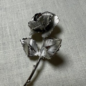 Silver rose deals brooch