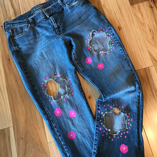 Holey distressed jeans with cutouts, trending cut out destroyed ripped embellished teen jeans, funky vintage 80s 90s retro college jeans for