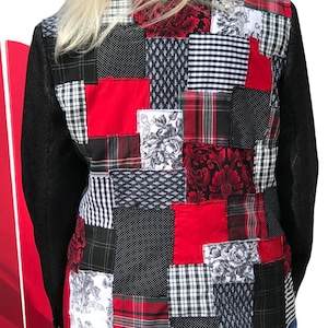 May include: A black denim jacket with a patchwork design on the back. The patches are made of various fabrics in red, black, white, and plaid patterns.