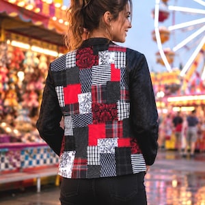 May include: A long-sleeve jacket featuring a patchwork back panel composed of various red, black, and white fabric squares in floral, plaid, and damask patterns. The sleeves and collar are solid black with a subtle tonal textured design.