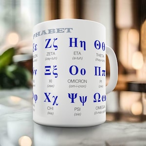May include: White ceramic mug printed with the Greek alphabet in blue. The mug shows Greek letters with their English transliterations and pronunciations. The word "PHABET" is printed at the top. Ideal for students or language enthusiasts.