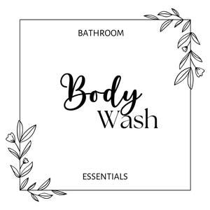 May include: Black and white illustration of a leafy branch with flowers in the corner of a square frame. The text "Bathroom Essentials" is at the bottom of the frame. The text "Body Wash" is in the centre of the frame.