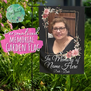 May include: Black memorial garden flag with a gold frame and floral accents. A photo of a woman is in the frame. The text reads "In Memory of Name Here Date - Date".