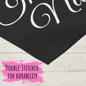 May include: Black doormat with white cursive text that reads "Grandma". The doormat has a stitched edge and a pink paint splatter that reads "Double Stitched for Durability".