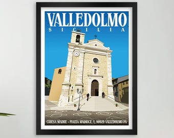 May include: A framed art print featuring a stylized illustration of the Valledolmo, Sicily church. The artwork depicts the church's facade in beige and white, set against a blue sky. The print includes the text "Valledolmo Sicilia" and the church's address.