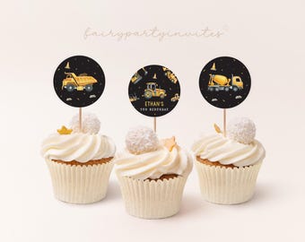 May include: Three yellow and black construction vehicle cupcake toppers with a black background. The toppers feature a dump truck, a cement mixer, and an excavator. The text on the excavator topper reads "Ethan's 3rd Birthday".