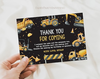 May include: Black thank you card with gold lettering that says "Thank You For Coming". The card is decorated with yellow construction vehicles and a black and yellow construction sign. The text reads "I enjoyed the cake and the presents too, but my favorite part was seeing you! Thanks for making my birthday so special! With love, Ethan."