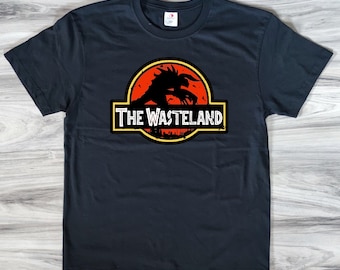 May include: Black t-shirt with a graphic of a dinosaur silhouette with the text "The Wasteland" printed on it.