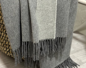 High quality soft and thin dark gray color natural merino wool blanket. Cozy throw with fun tassels.