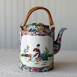 Chinese Export Porcelain Teapot in the Rose Medallion / Rose Canton family, with a Mandarin figural panel.