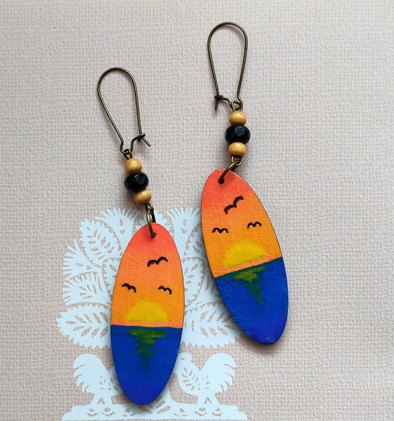 Hand-painted wooden earrings. This wearable landscape painting is titled  