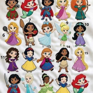 May include: A white ceramic mug with a black handle and the text "But First, Coffee" in a black, bold font. The mug is on a white surface.