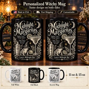 May include: A black ceramic mug featuring a white graphic print with the text Midnight Margaritas, a cocktail shaker, a margarita glass, a lime, and a toad wearing a witch hat. The design includes the text Tequila, Lime, Orange Liqueur.