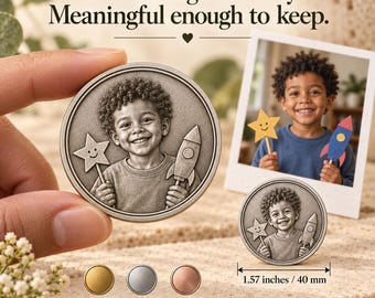May include: A circular metal coin featuring an embossed portrait of a young child holding a star and a rocket. The text reads: Small enough to carry. Meaningful enough to keep. A measurement line indicates a diameter of 1.57 inches. Includes gold, silver, and rose gold color options.