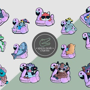 May include: A selection of vibrant shoe charms depicting animals and characters on pink flamingo floats. The charms include a penguin, fox, skeleton, alligator, shark, cat, turtle, cow, bear, dog, and a wizard. The charms are colorful.