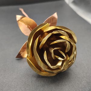 Hand forged brass rose with copper leaves
