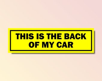 May include: A yellow rectangular sticker with black text that reads "This is the back of my car."