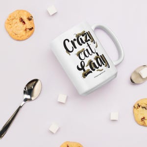 Crazy Cat Lady Mug, Monarch Caterpillar Coffee Mug, Funny Nature Pun Mug, Butterfly Lover Mug, Double Sided Ceramic Mug  Glossy ceramic coffee mug featuring a double sided design with the text Crazy Cat Lady surrounded by monarch caterpillars, playful nature pun artwork for butterfly enthusiasts and gardeners, ceramic coffee mug available in 11 oz 15 oz and 20 oz sizes, dishwasher and microwave safe