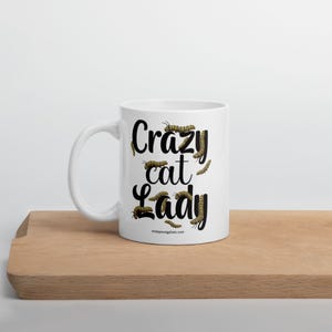 Crazy Cat Lady Mug, Monarch Caterpillar Coffee Mug, Funny Nature Pun Mug, Butterfly Lover Mug, Double Sided Ceramic Mug  Glossy ceramic coffee mug featuring a double sided design with the text Crazy Cat Lady surrounded by monarch caterpillars, playful nature pun artwork for butterfly enthusiasts and gardeners, ceramic coffee mug available in 11 oz 15 oz and 20 oz sizes, dishwasher and microwave safe