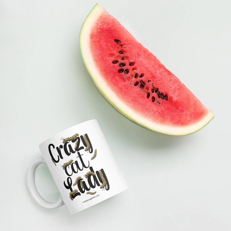 Crazy Cat Lady Mug, Monarch Caterpillar Coffee Mug, Funny Nature Pun Mug, Butterfly Lover Mug, Double Sided Ceramic Mug  Glossy ceramic coffee mug featuring a double sided design with the text Crazy Cat Lady surrounded by monarch caterpillars, playful nature pun artwork for butterfly enthusiasts and gardeners, ceramic coffee mug available in 11 oz 15 oz and 20 oz sizes, dishwasher and microwave safe