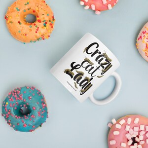 Crazy Cat Lady Mug, Monarch Caterpillar Coffee Mug, Funny Nature Pun Mug, Butterfly Lover Mug, Double Sided Ceramic Mug  Glossy ceramic coffee mug featuring a double sided design with the text Crazy Cat Lady surrounded by monarch caterpillars, playful nature pun artwork for butterfly enthusiasts and gardeners, ceramic coffee mug available in 11 oz 15 oz and 20 oz sizes, dishwasher and microwave safe