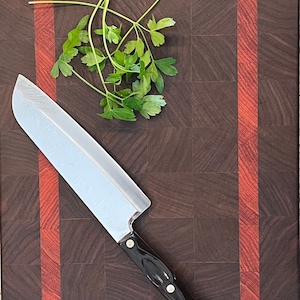 Black Walnut End Grain Cutting Board with African Padauk accent. Dimensions 15x11x1.5 inches.