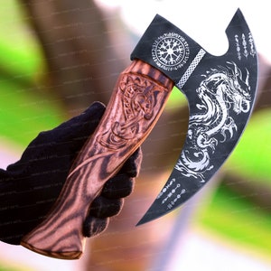 May include: A black axe with a wooden handle. The axe head has a dragon design and a circular design with runes. The handle is carved with a knotwork design.