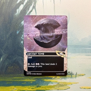 May include: A rectangular trading card titled Ancient Tomb featuring a dark, spherical, shell-like object floating in a purple cosmic space. The card text reads: Land, Tap: Add two colorless mana. This land deals 2 damage to you. M 0091.
